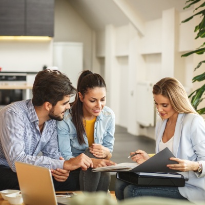 happy people looking over documents remedy therapy