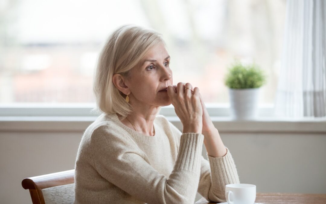 woman in deep thought at table remedy therapy